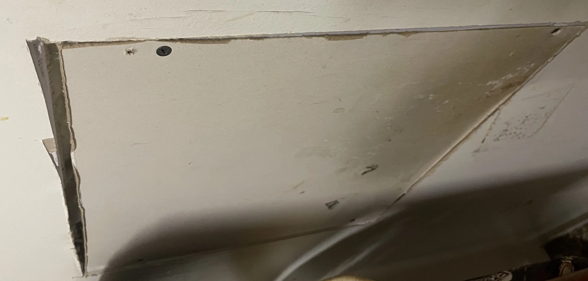 A ceiling access hatch cut in and fitted