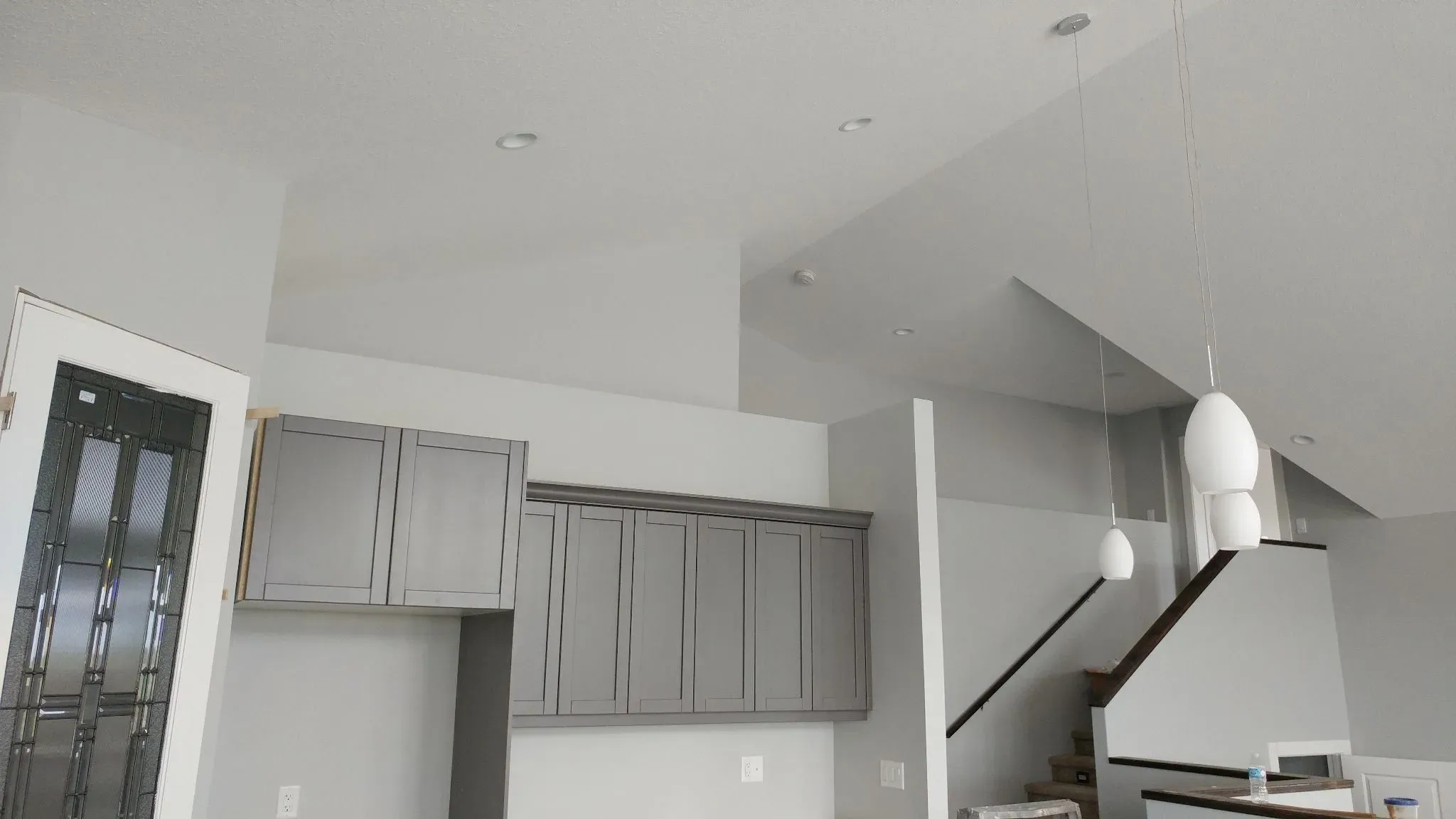 Finished kitchen with smooth painted walls and ceiling by Wild West Drywall